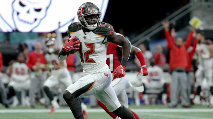 Nov 24, 2019; Atlanta, GA, USA; Tampa Bay Buccaneers wide receiver Chris Godwin (12) runs for a long touchdown catch in the first quarter against the Atlanta Falcons at Mercedes-Benz Stadium. Mandatory Credit: Jason Getz-USA TODAY Sports